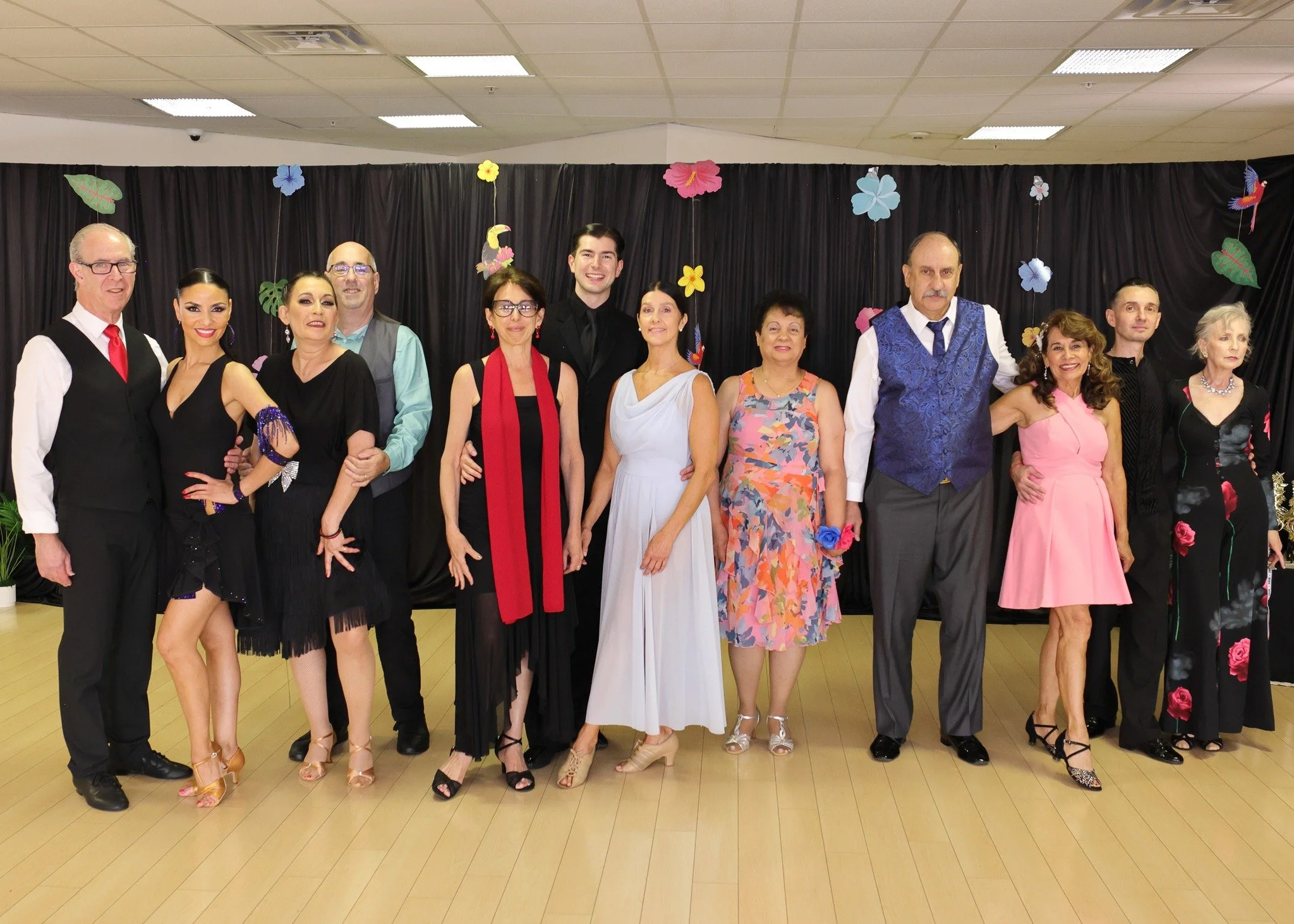 Summer Showcase performers pose together in colorful dance attire