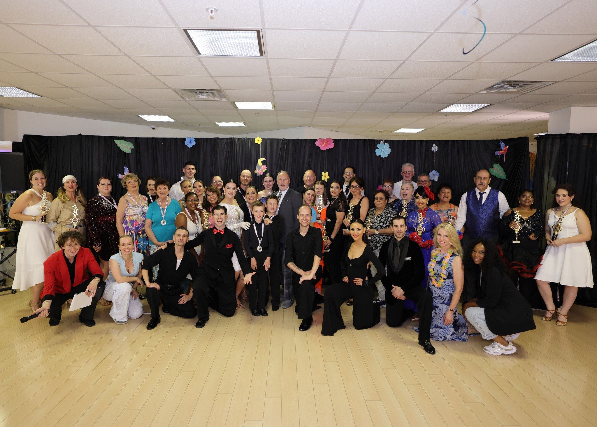 The Summer Showcase group gathers on the studio dance floor