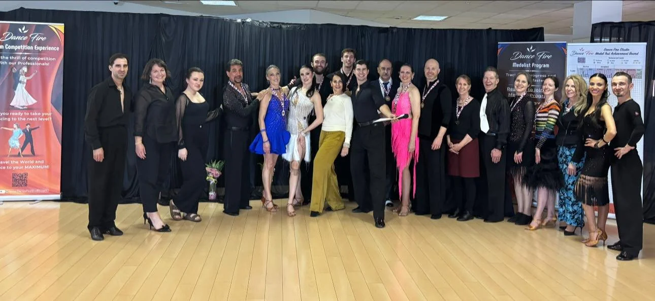 Dancers pose together after the spring Medal Achievement event