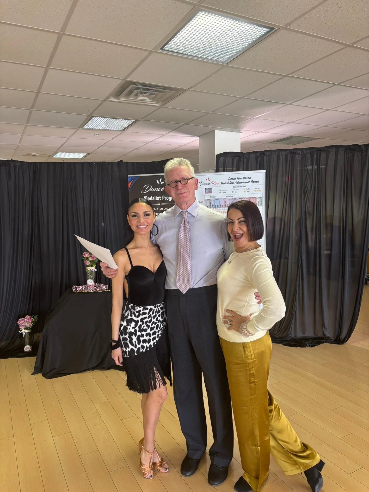 A dance student poses with the spring event judge and instructor