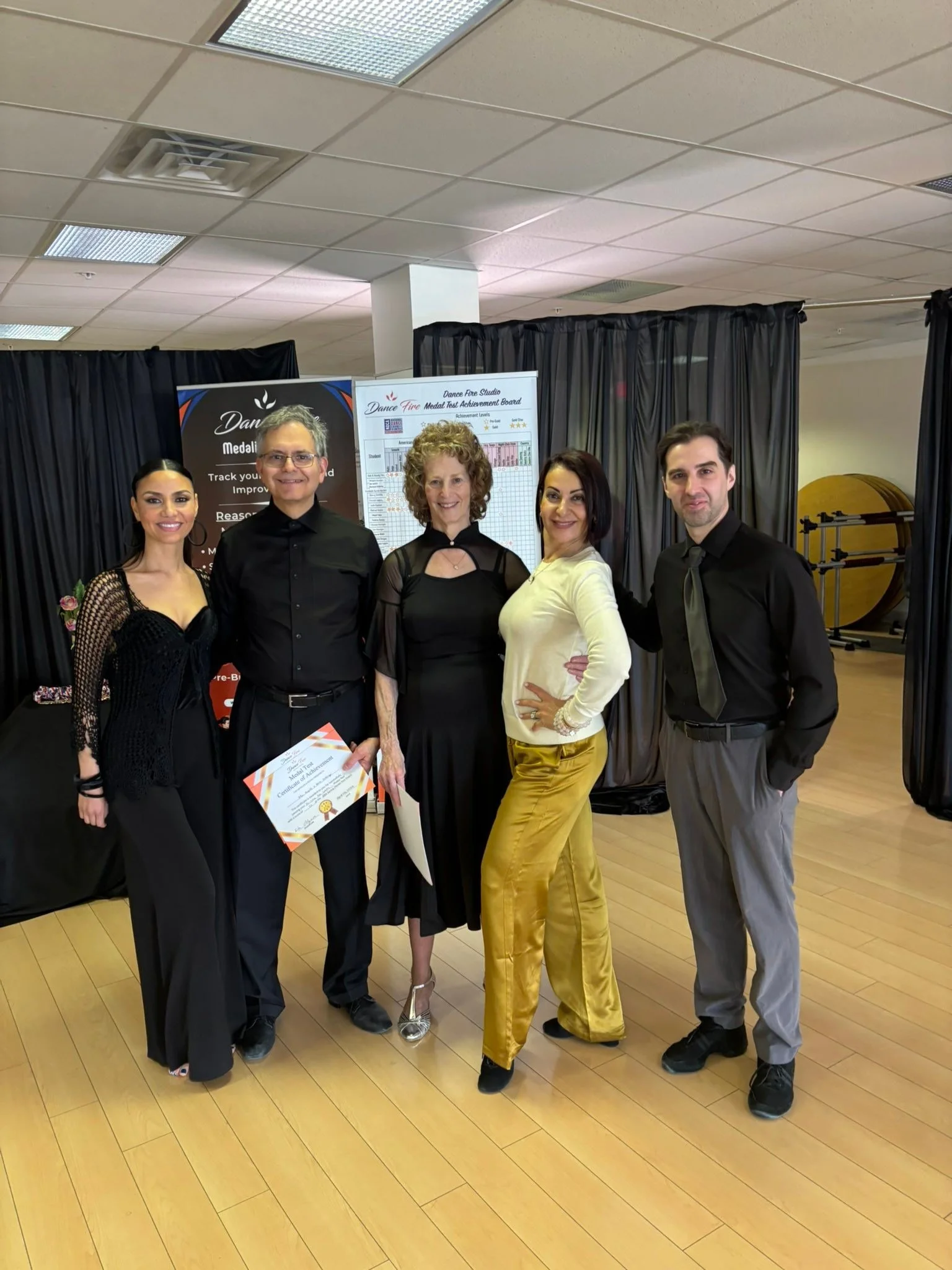 Spring event participants pose together with their assessment certificates
