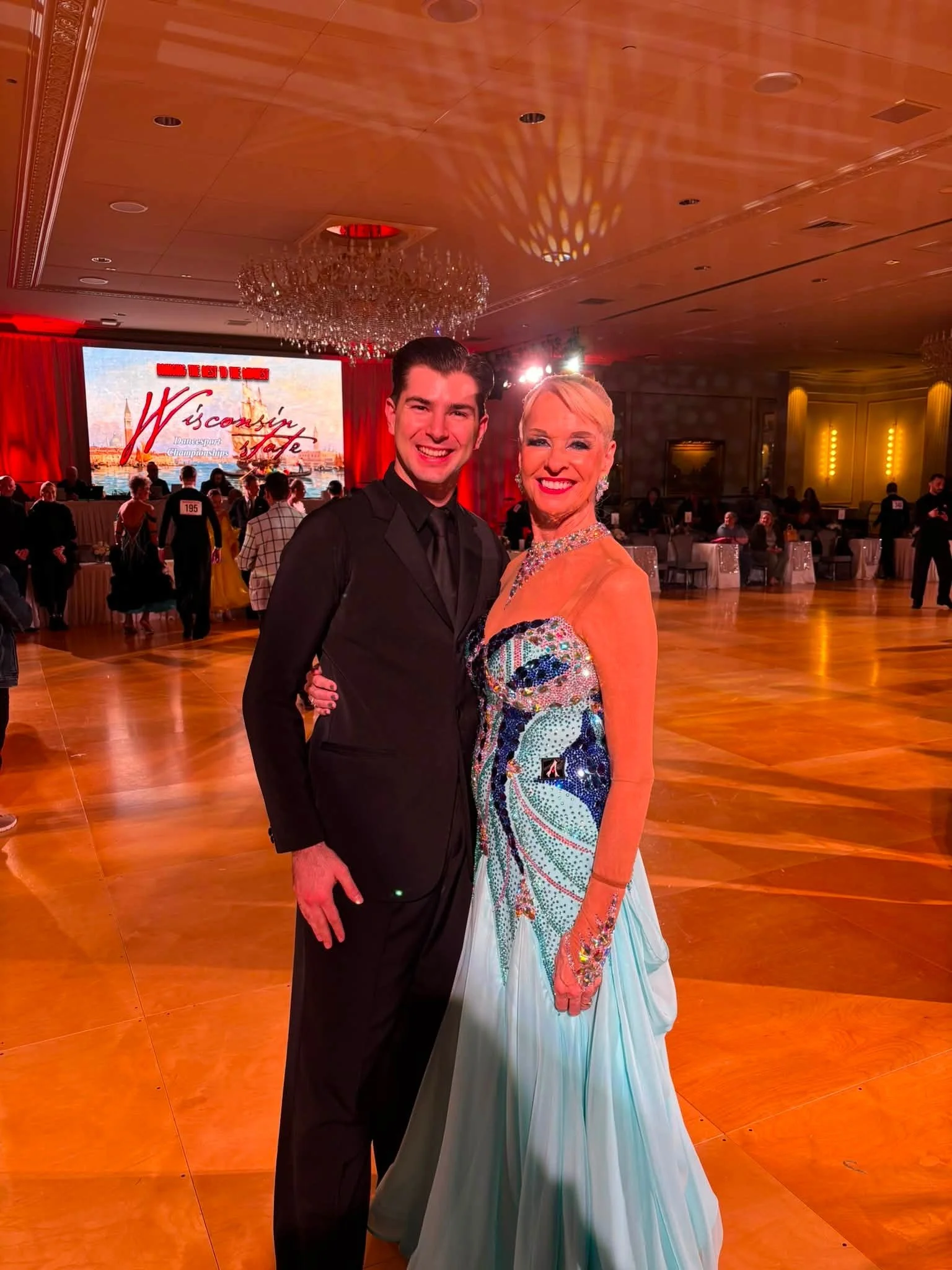 Jeanette and her dance partner pose at Wisconsin State DanceSport