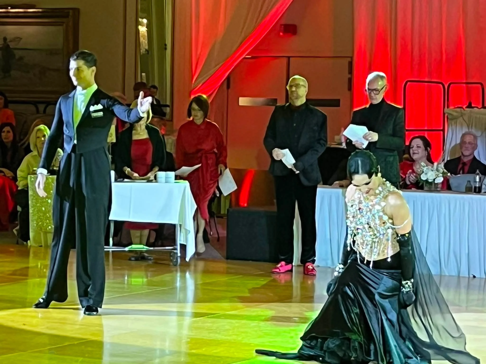 A ballroom couple dances on the Wisconsin State DanceSport competition floor