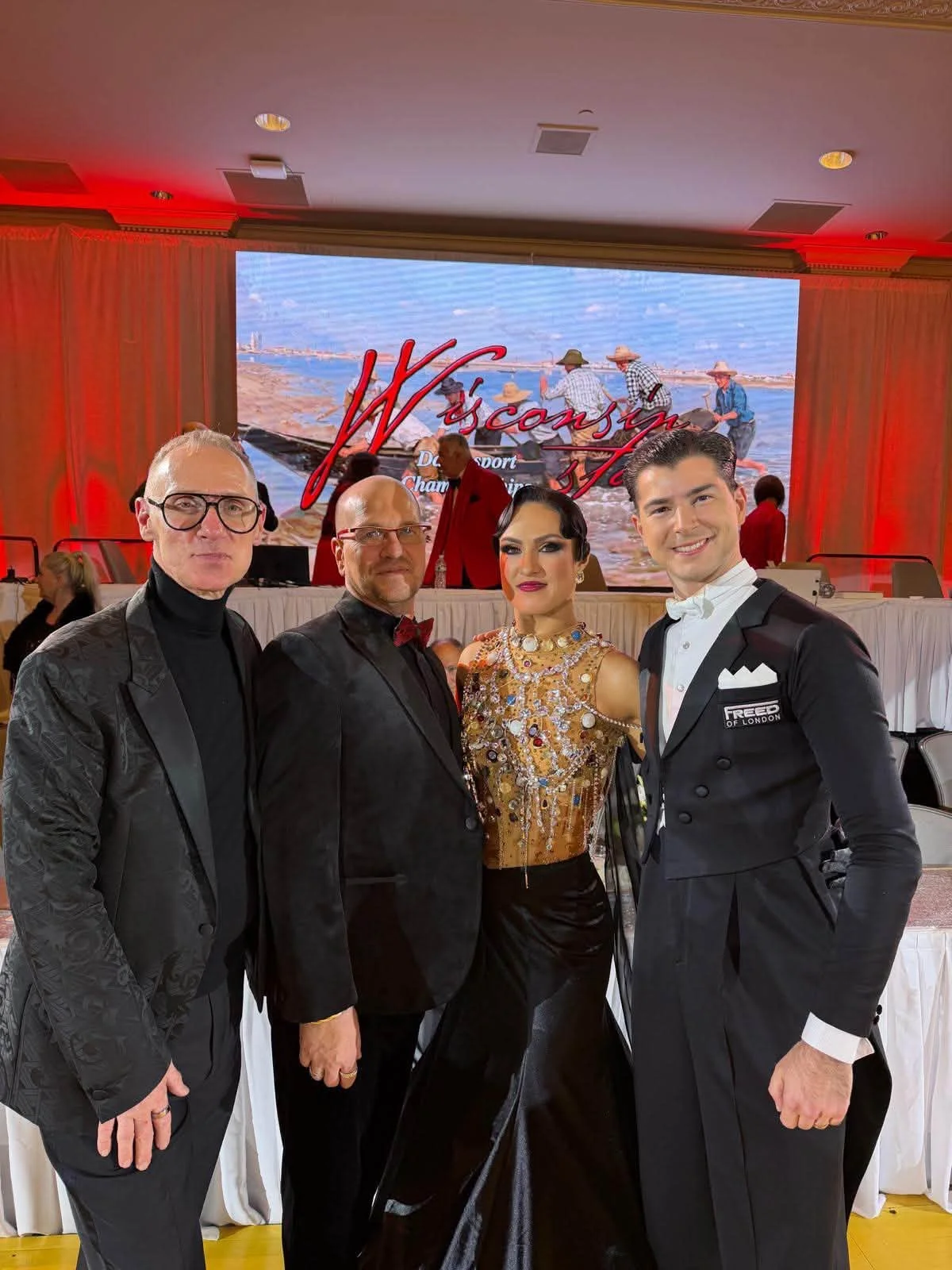 Dance Fire participants pose with an event organizer at Wisconsin State DanceSport