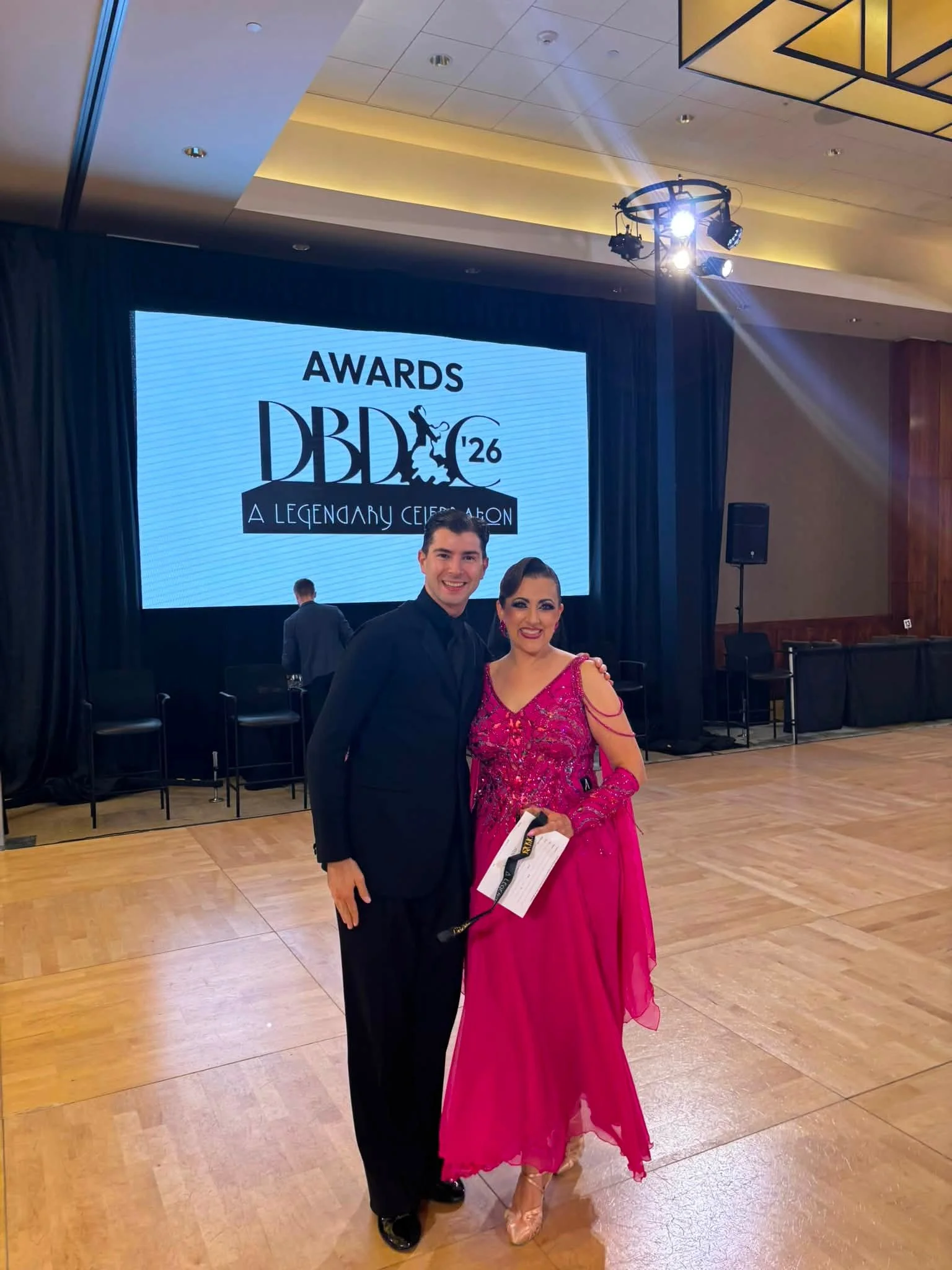 Jennifer and her dance partner on the DBDC Boston competition floor