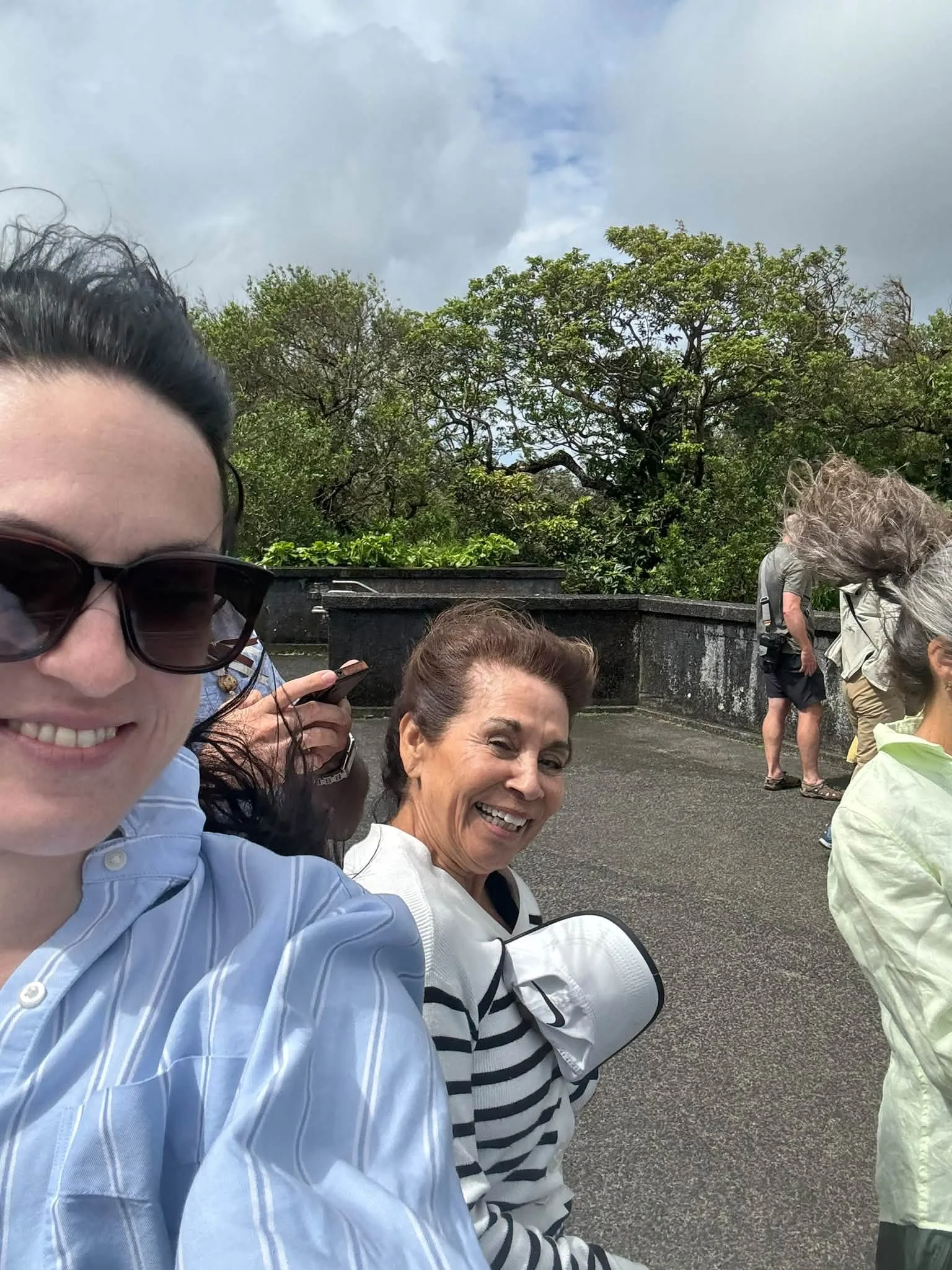 Two travelers share a selfie during their Hawaii sightseeing walk