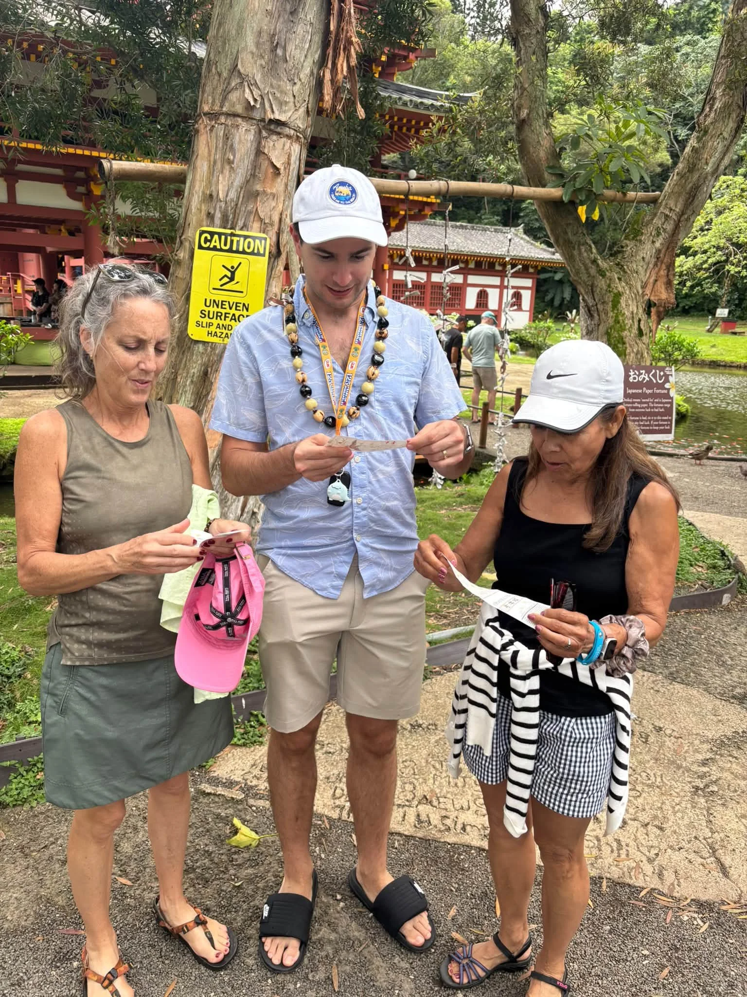 Three Dance Fire travelers pose together during a Hawaii garden visit