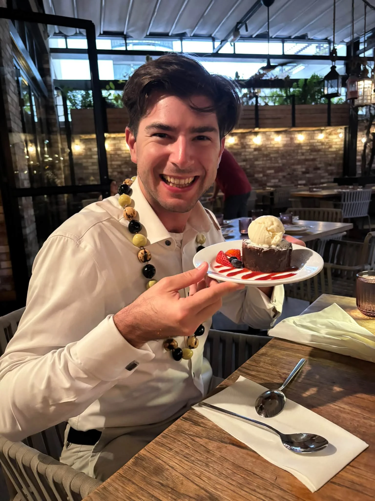 A Dance Fire traveler enjoys a dessert during the Hawaii trip