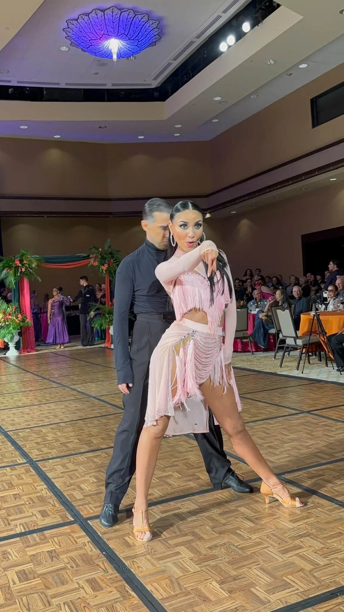 A ballroom pair performs together on the Hawaii competition floor