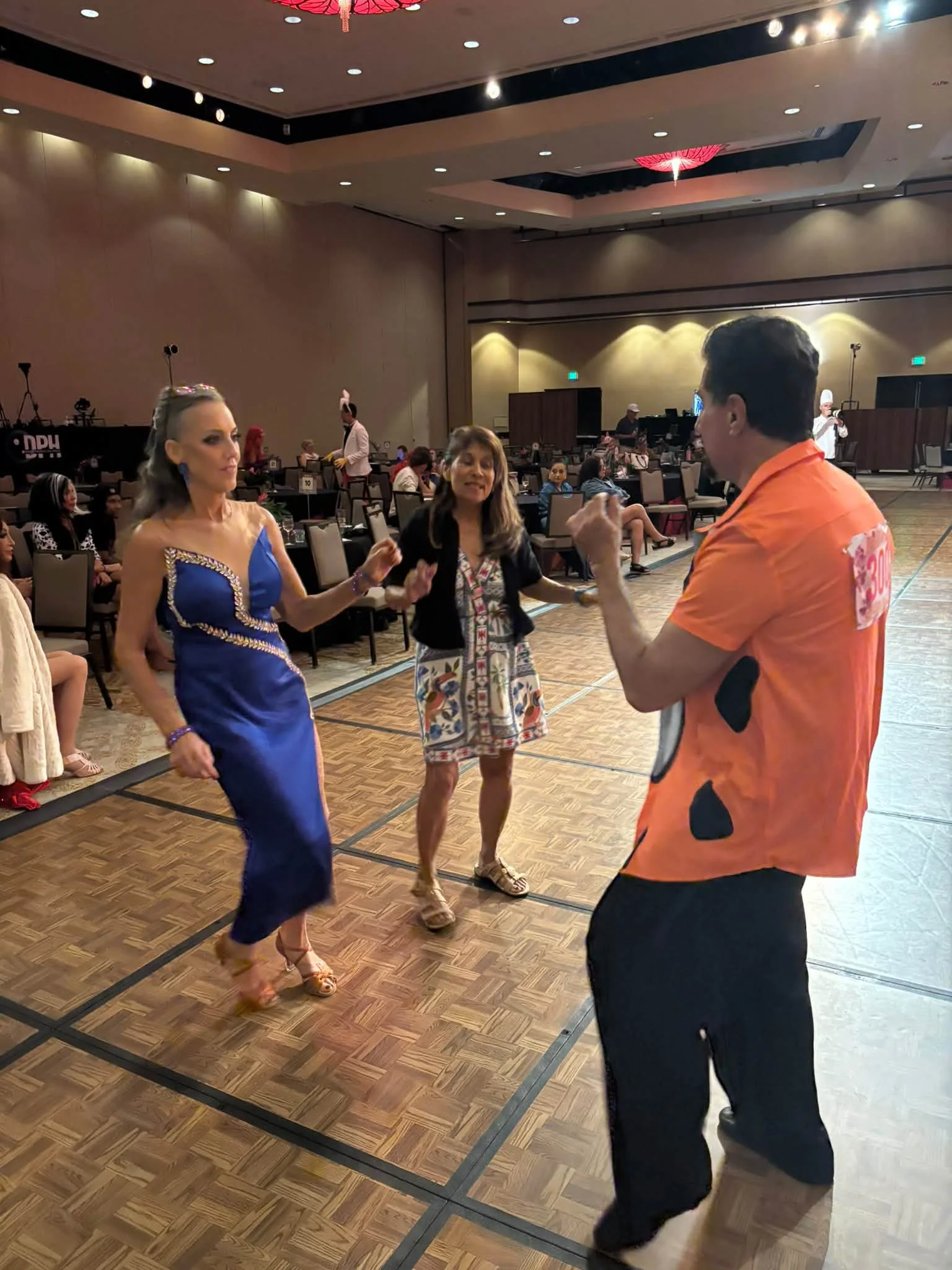 Guests practice social dance steps during the Hawaii evening event