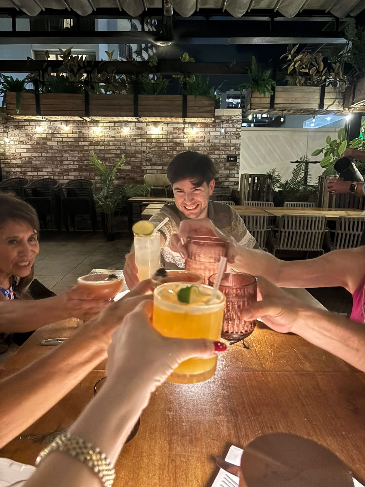 The Dance Fire group shares a toast during the Hawaii trip