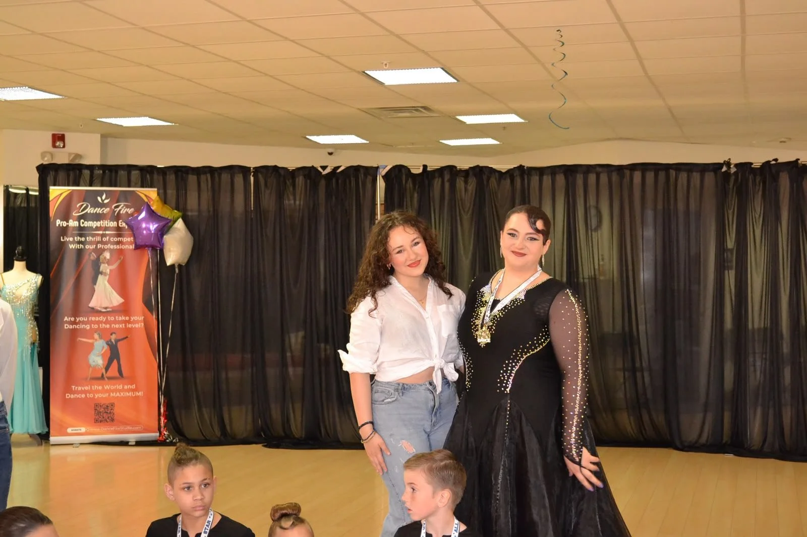 Two young performers pose after the Dance Fire youth recital