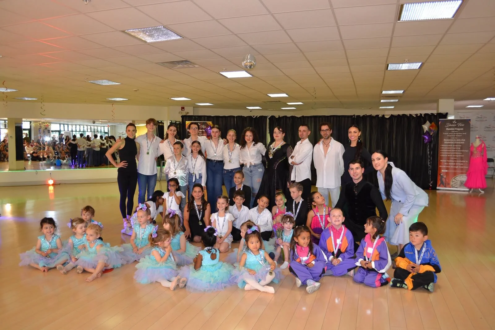 Dance Fire’s youth recital performers gather for a studio group photograph