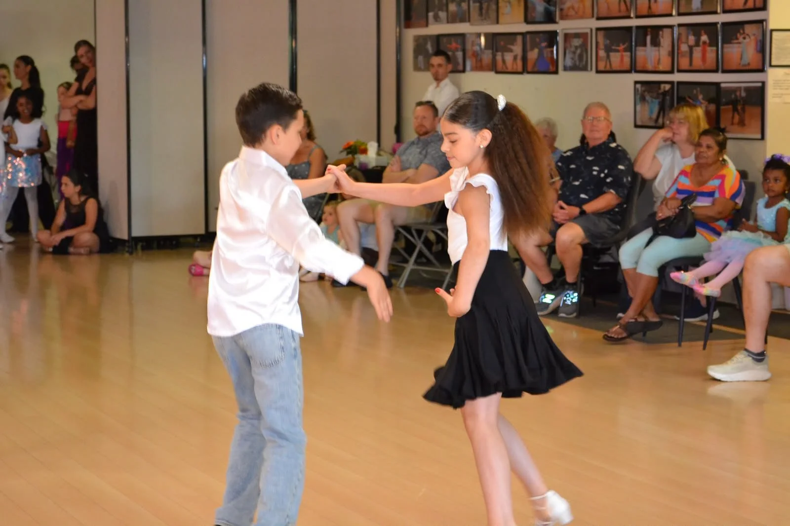 Youth partners perform before the seated studio audience
