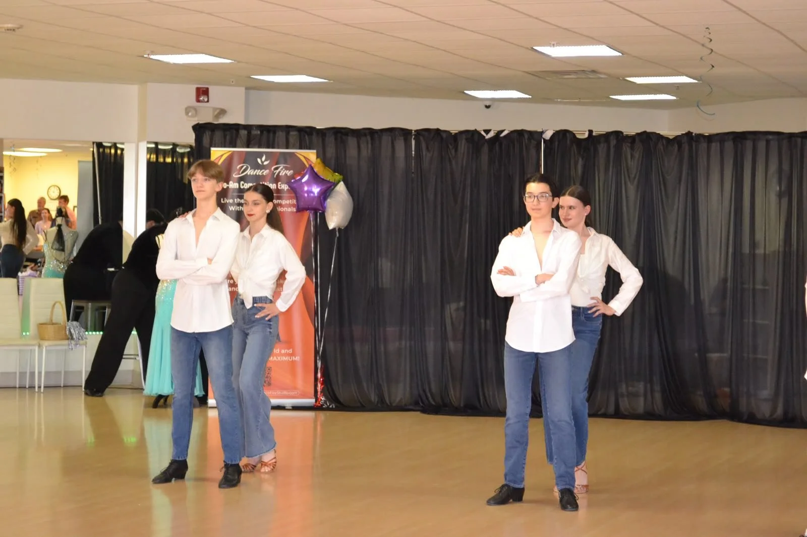 Young performers hold their positions during a group dance routine