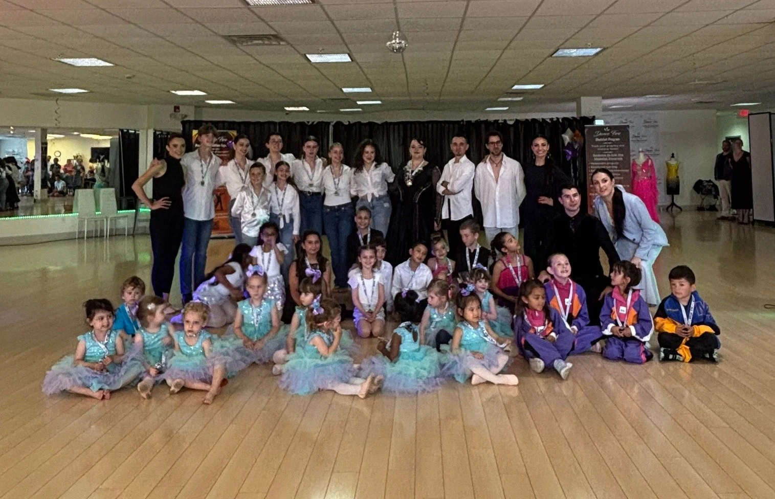 The complete youth recital group poses together on the Dance Fire studio floor