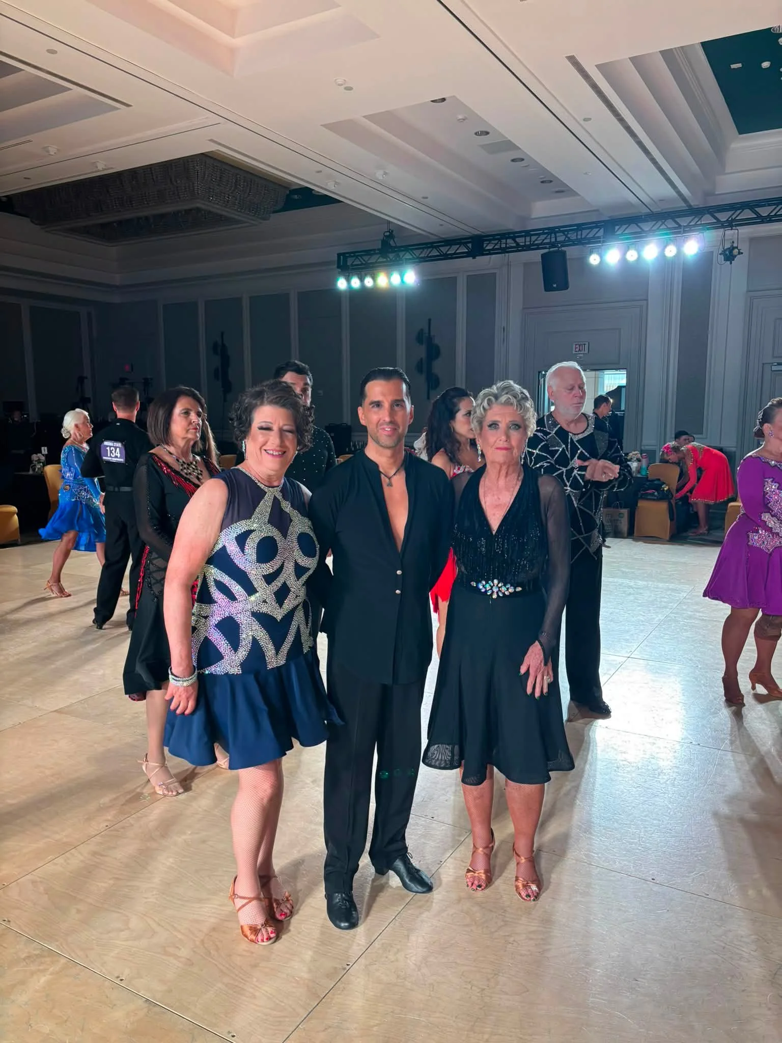 Dance Fire participants pose in dance attire at Virginia DanceSport