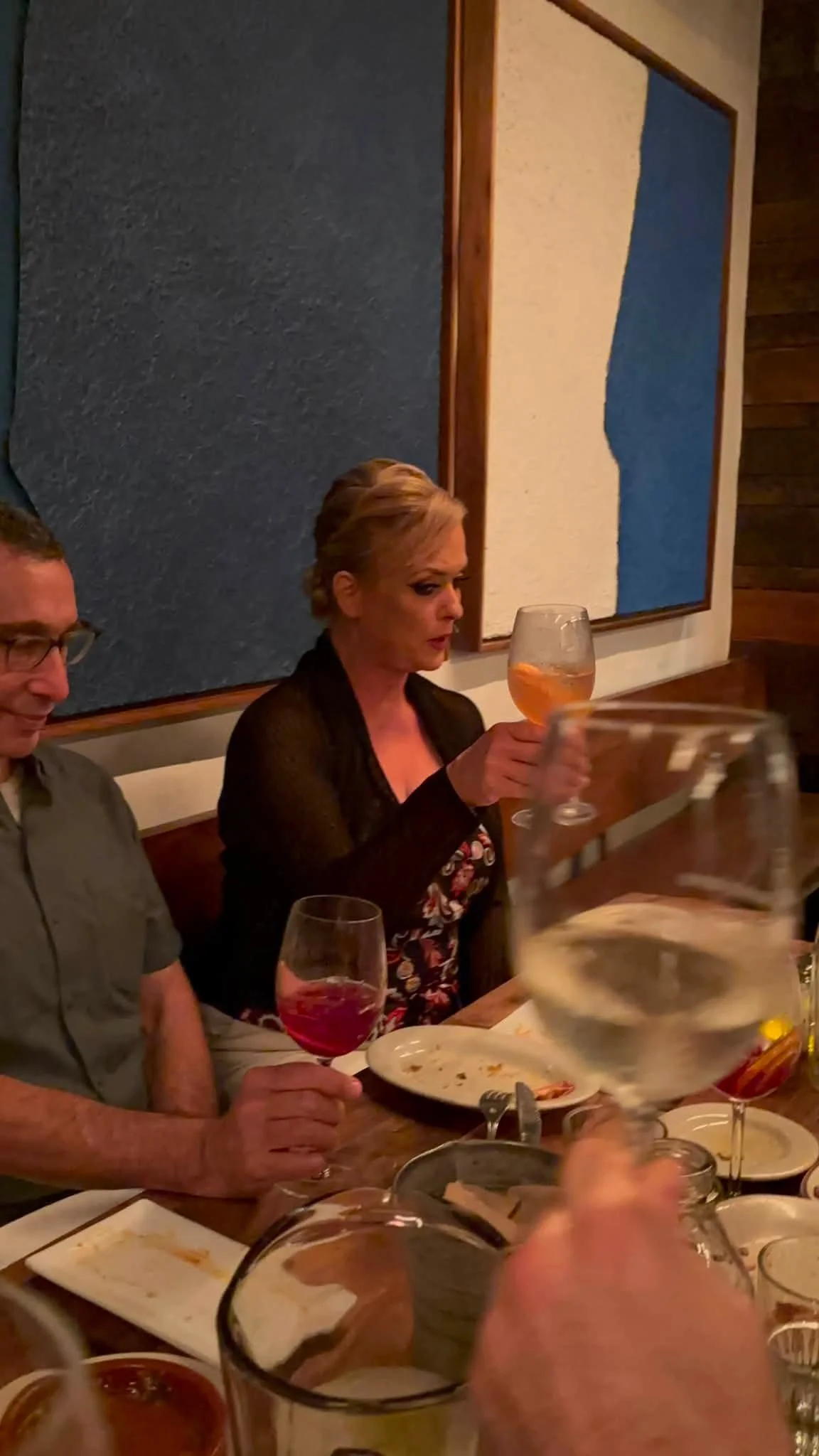 A team member shares a meal with fellow Dance Fire travelers