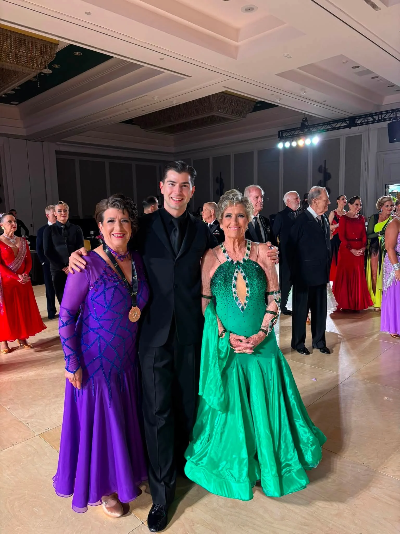 Dance Fire participants pose in colorful ballroom attire in Virginia
