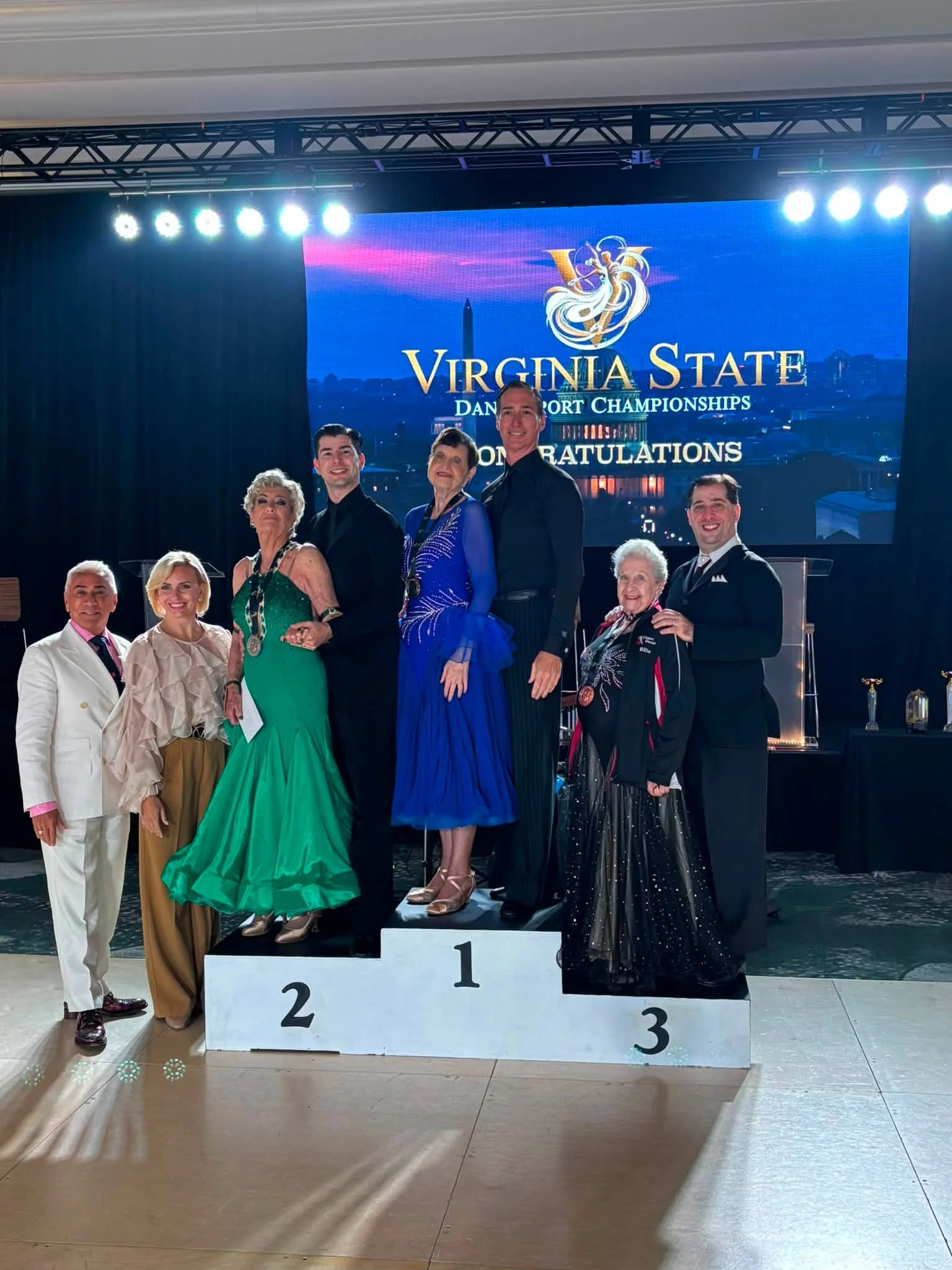Virginia DanceSport ballroom finalists pose on the awards podium