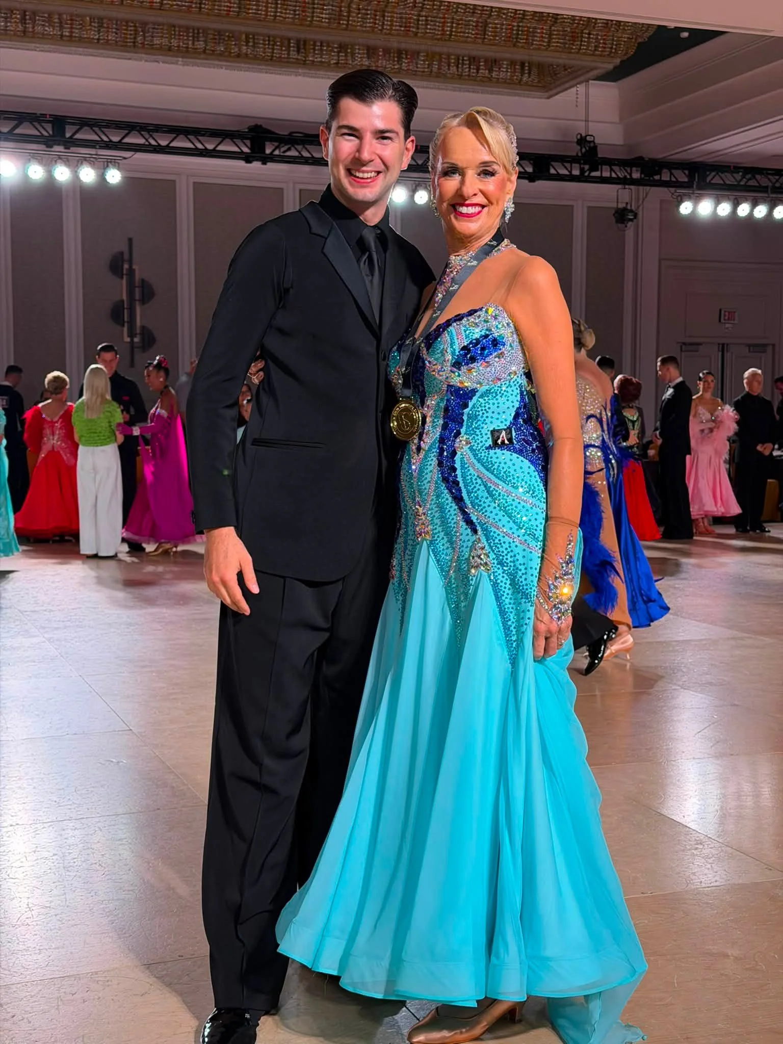 A ballroom pair poses together after dancing at Virginia DanceSport