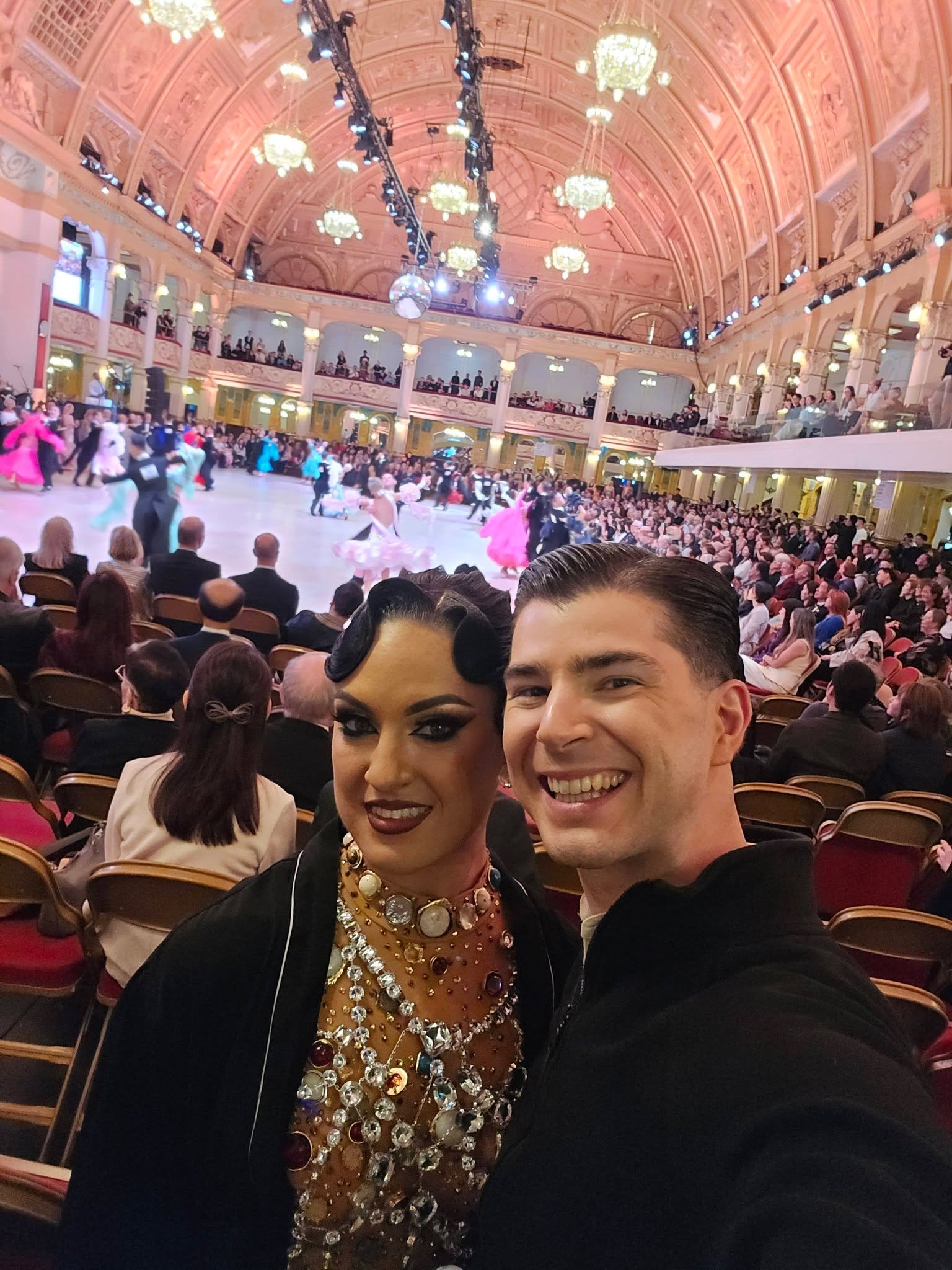 Florin and Natalia pose with the Blackpool ballroom audience behind them