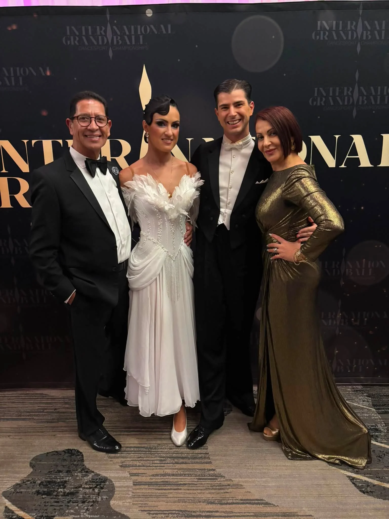Florin and Natalia pose with event hosts at International Grand Ball