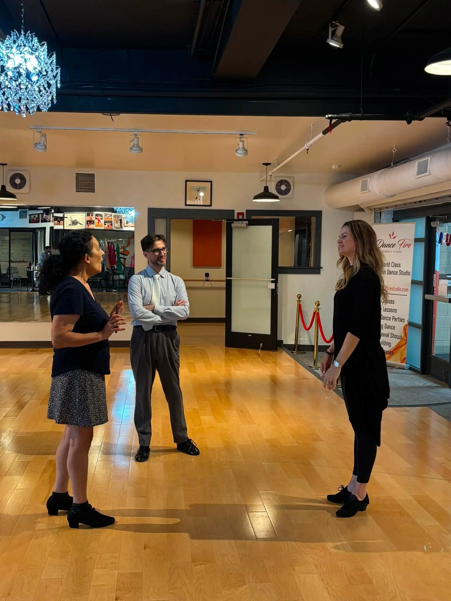 Coaching participants work together on the studio dance floor