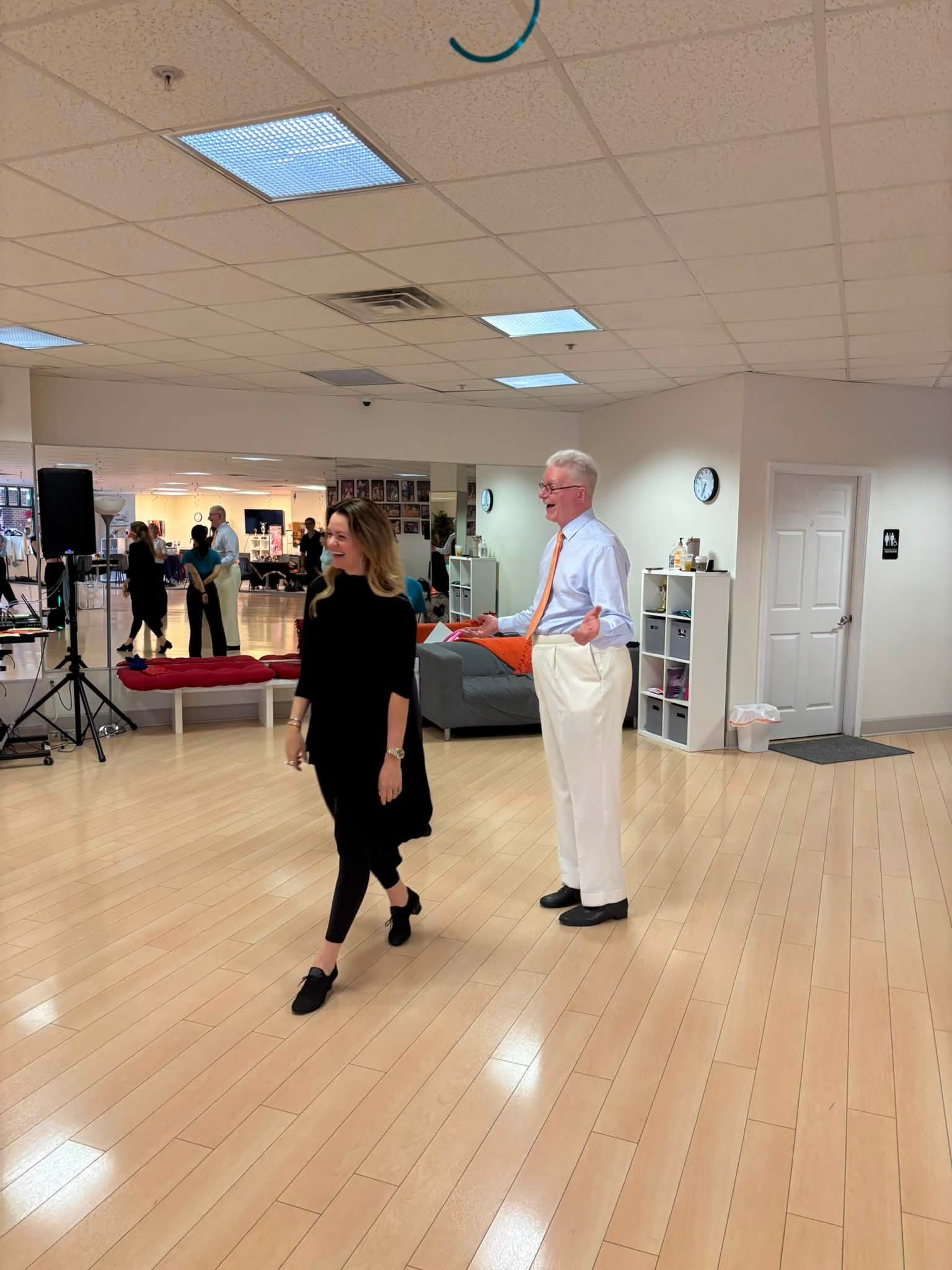 A pair steps together during a Dance Fire coaching exercise