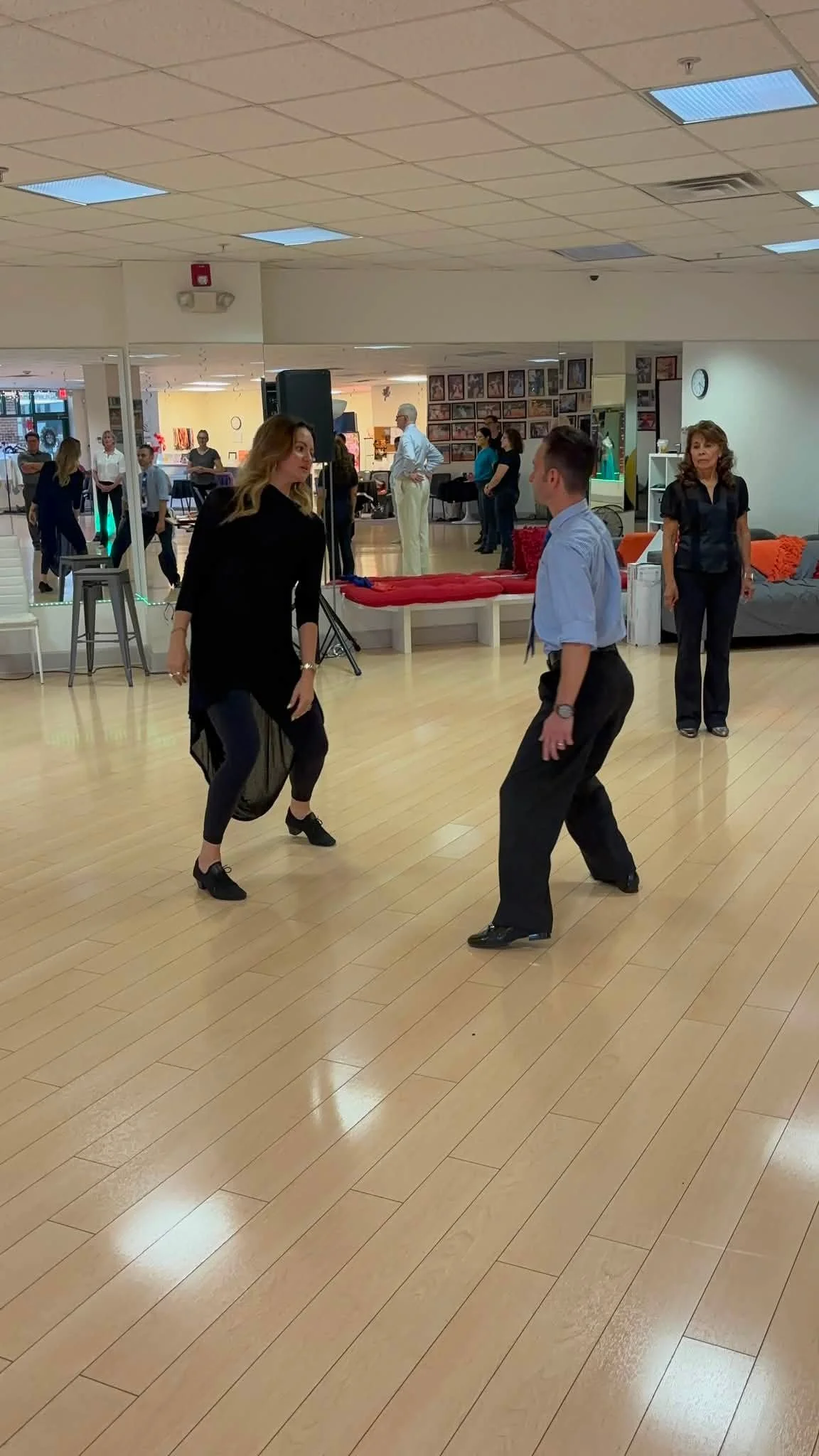 Dancers watch a partnered movement demonstration during the coaching visit