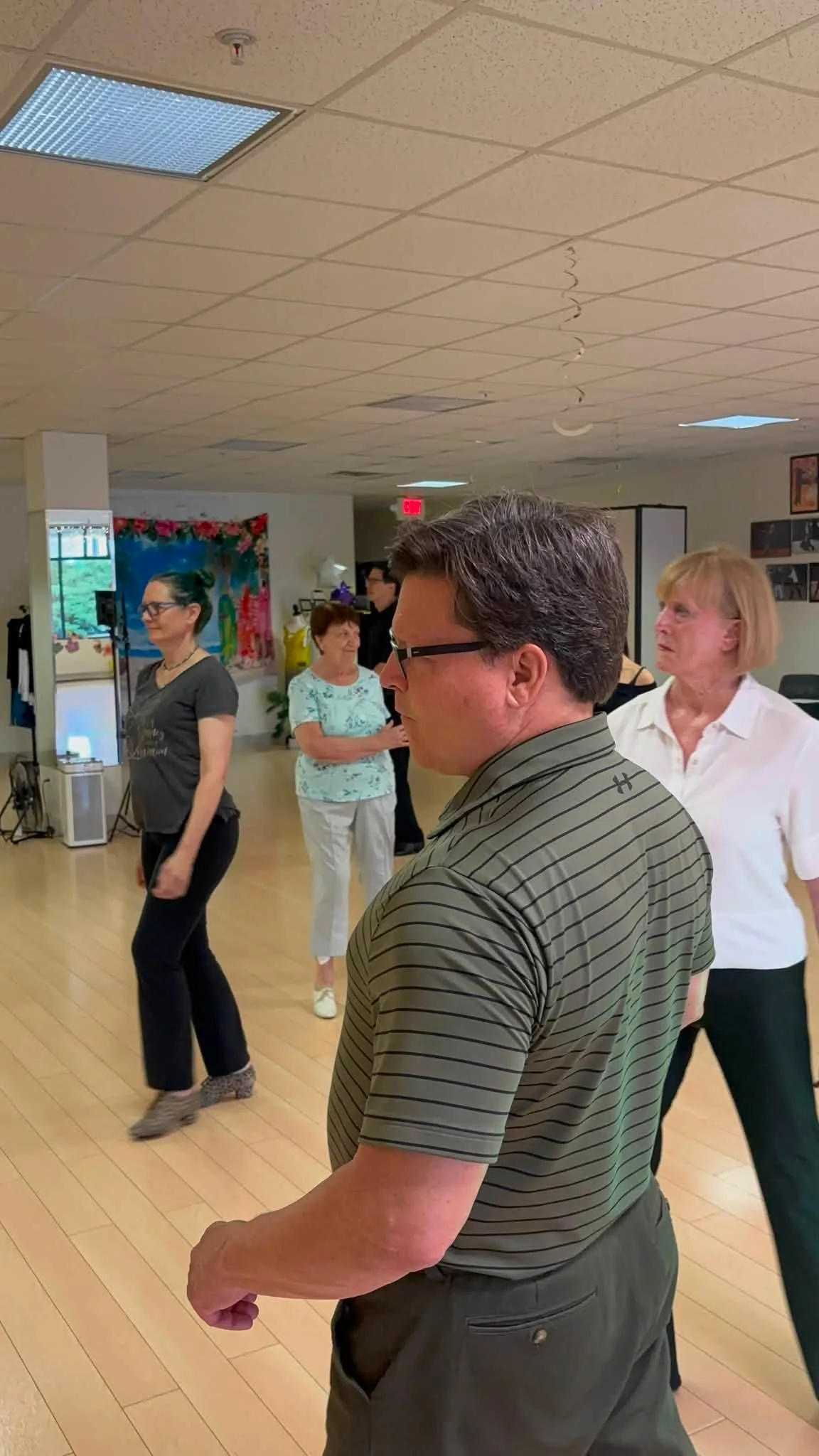 Class participants observe the coaching demonstration