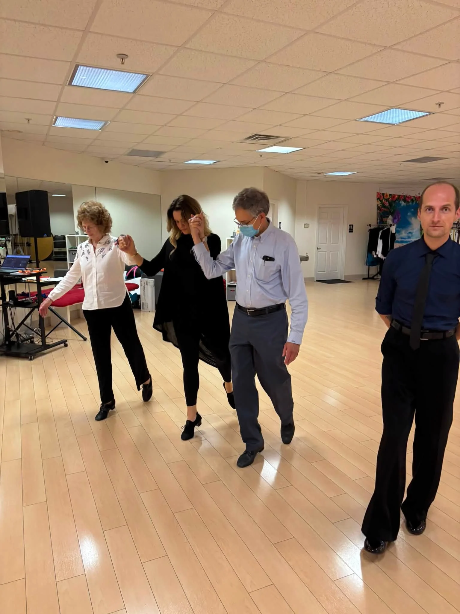 Coaching participants practice coordinated movement in a line