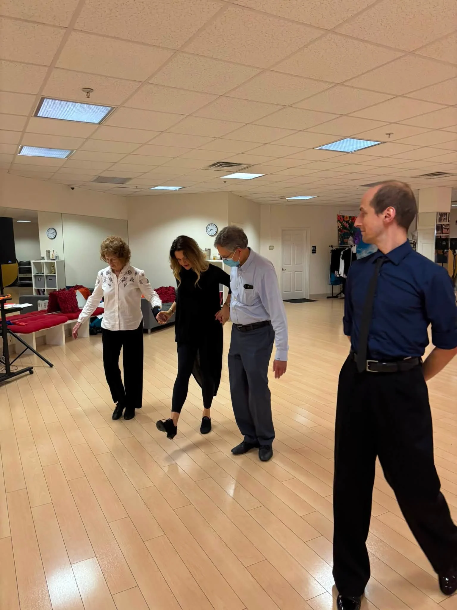 Dancers work through a leading-and-following exercise together