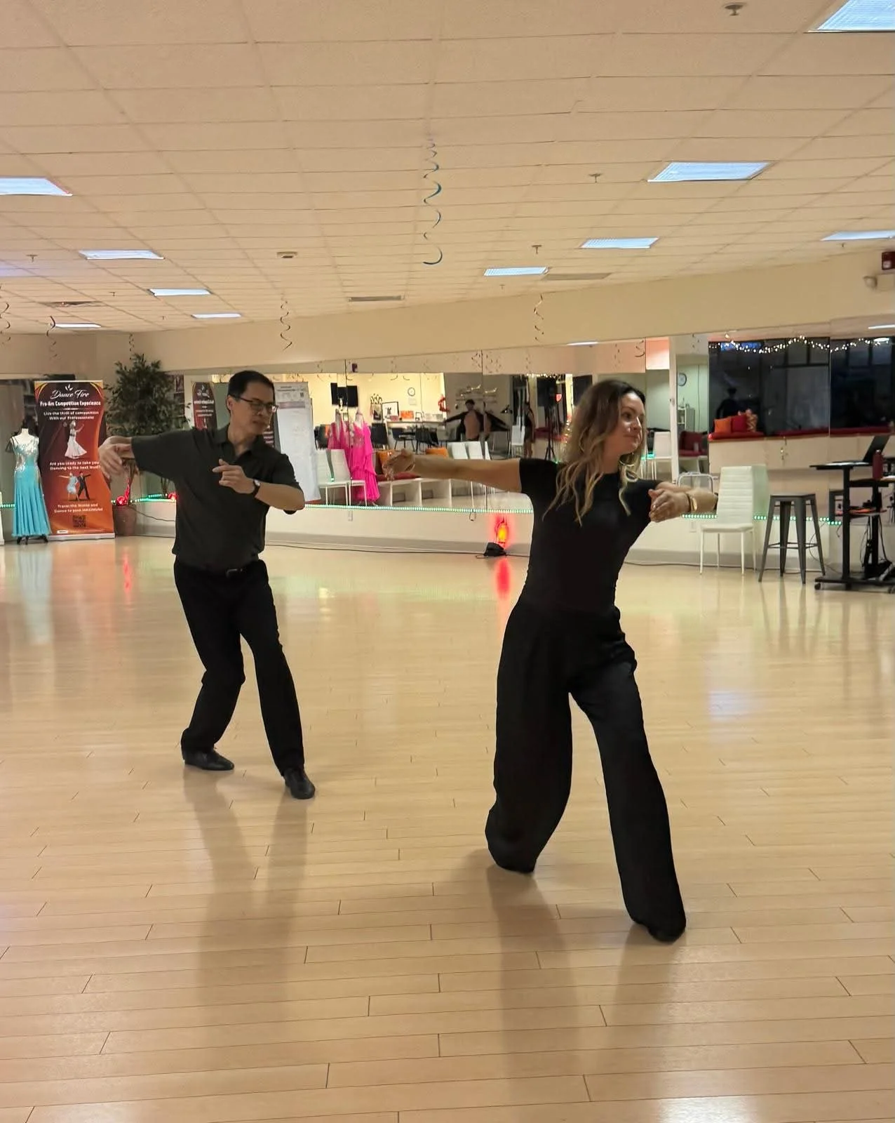 Participants practice coordinated steps during the leading-and-following class