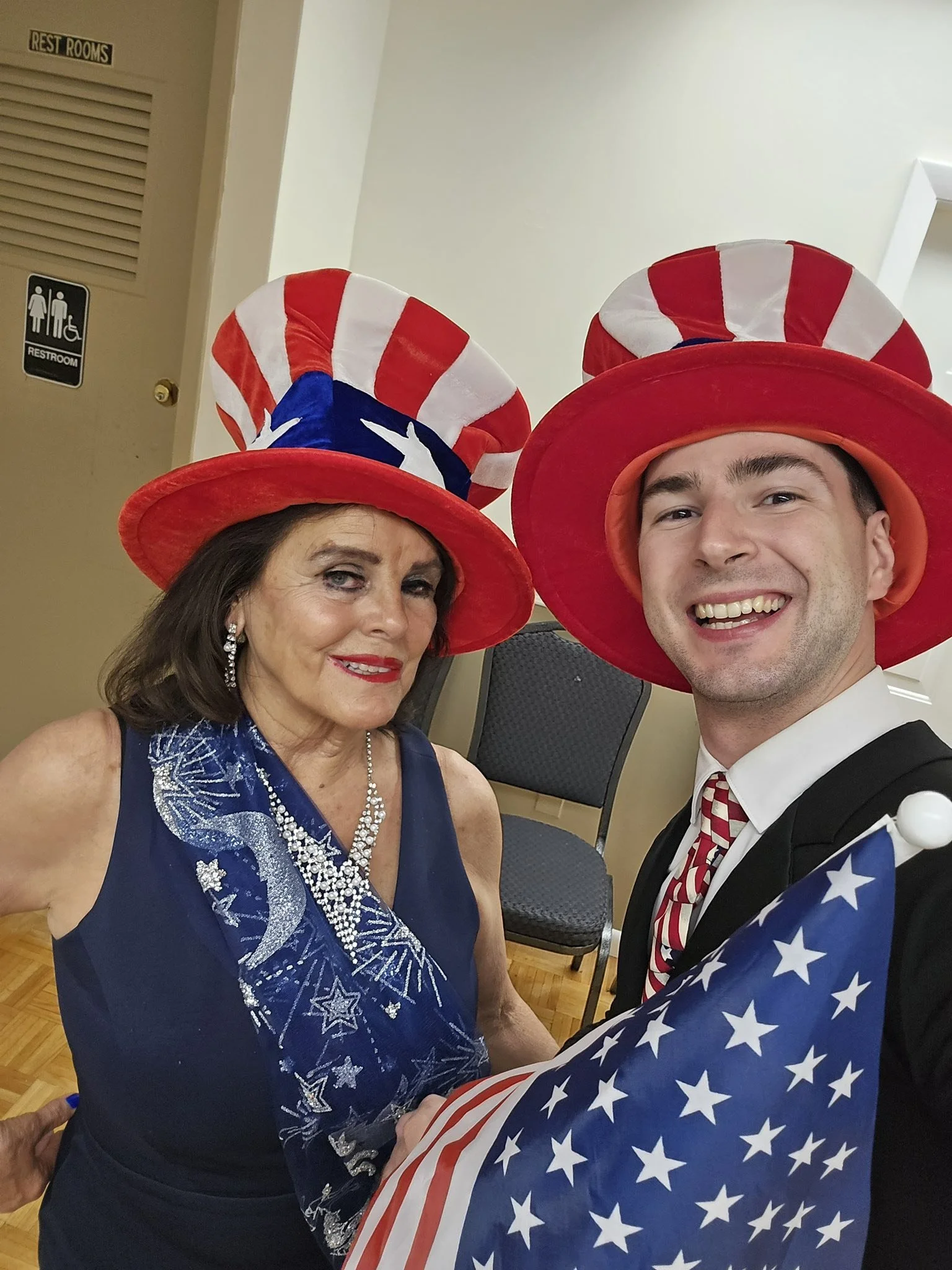 Showcase dancers wearing red, white, and blue costumes and hats