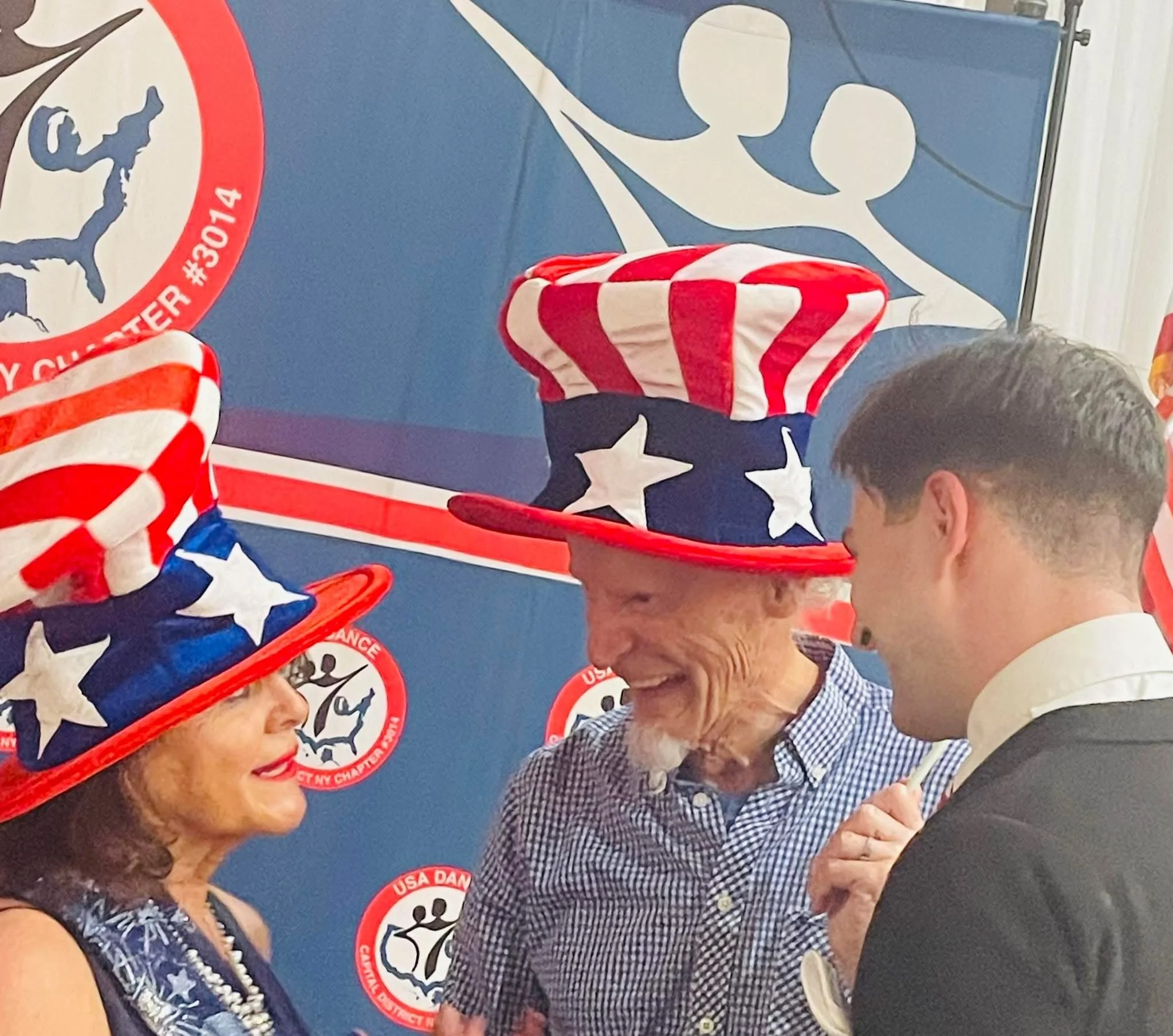 Participants share a moment at the USA Dance Social honoring Fred