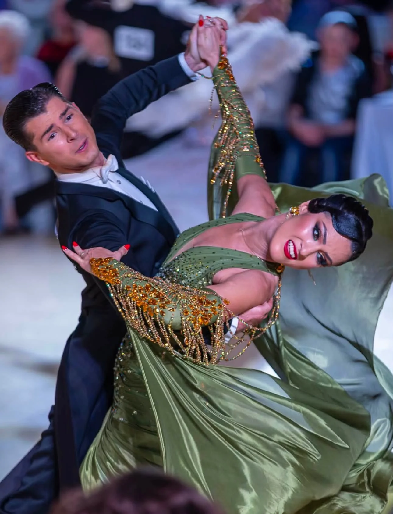 Florin and Natalia dance in formal ballroom attire at the World Professional Ballroom Championship