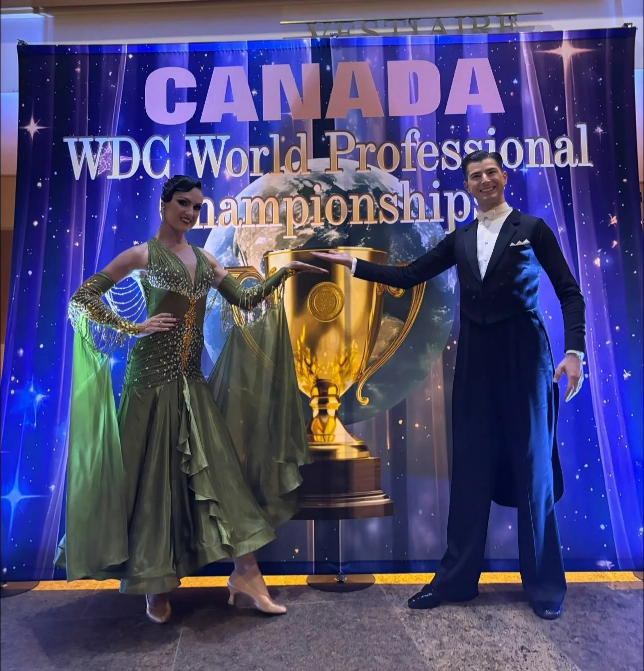 Florin and Natalia pose with the World Championship trophy display