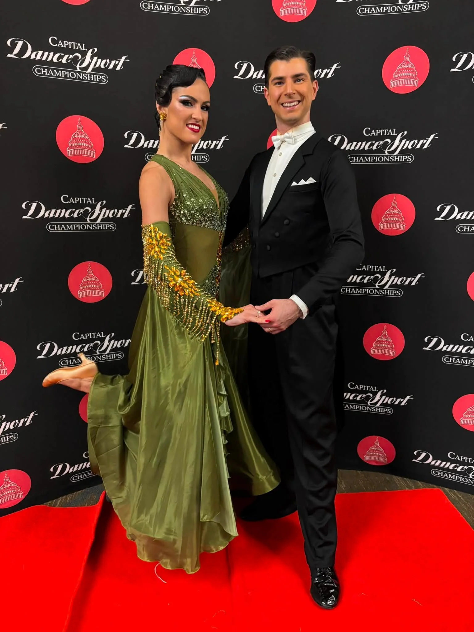 Florin and Natalia pose at the championship event backdrop