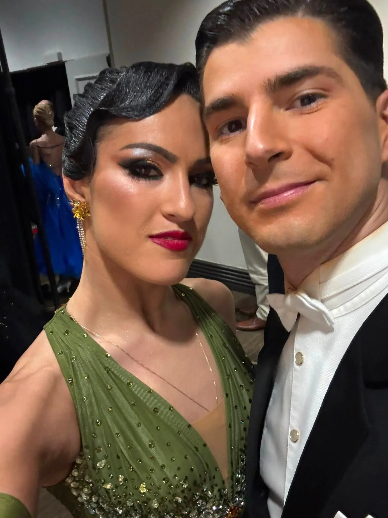 Florin and Natalia take a close-up photo in their ballroom competition attire