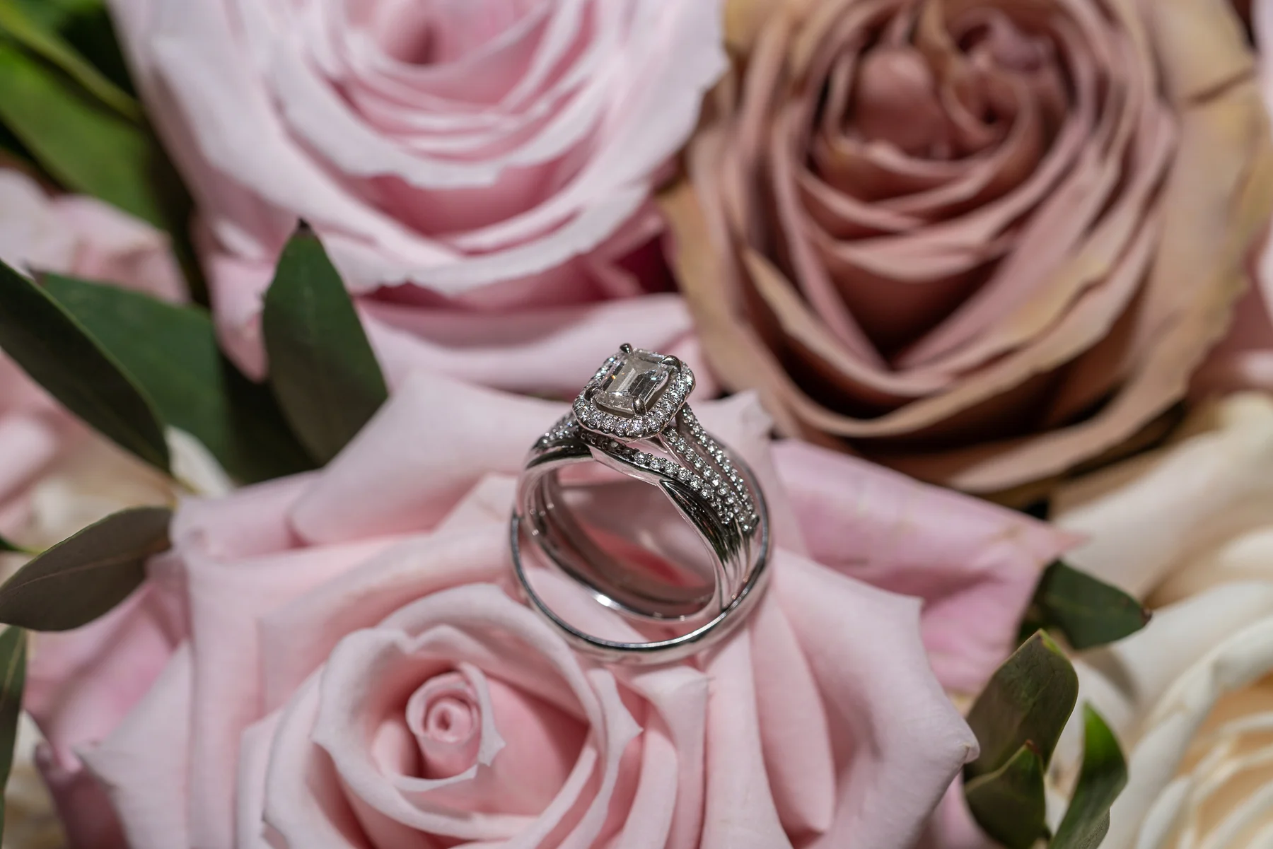 The rings nestled on the Bride’s bouquet.