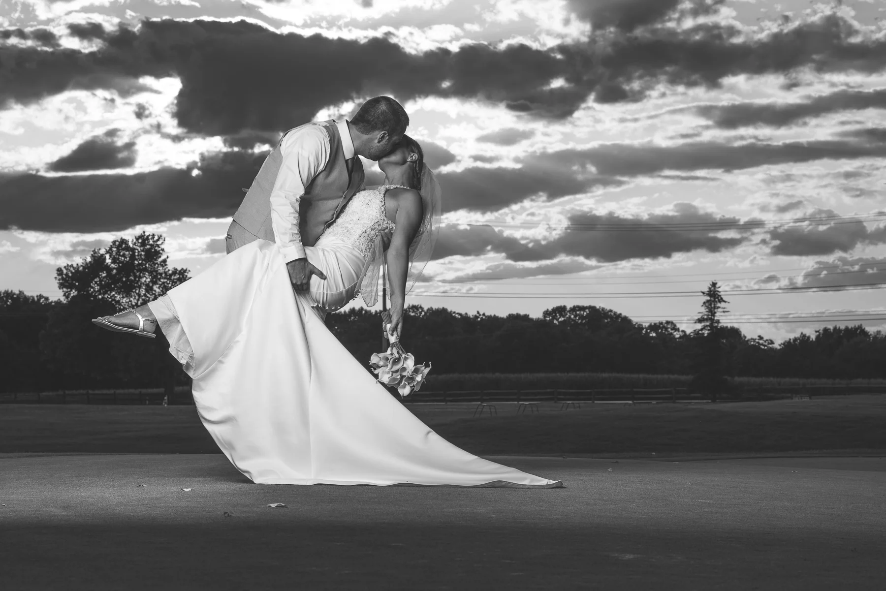 Black and white wedding photo on the Bridges Golf Course at sunset.
