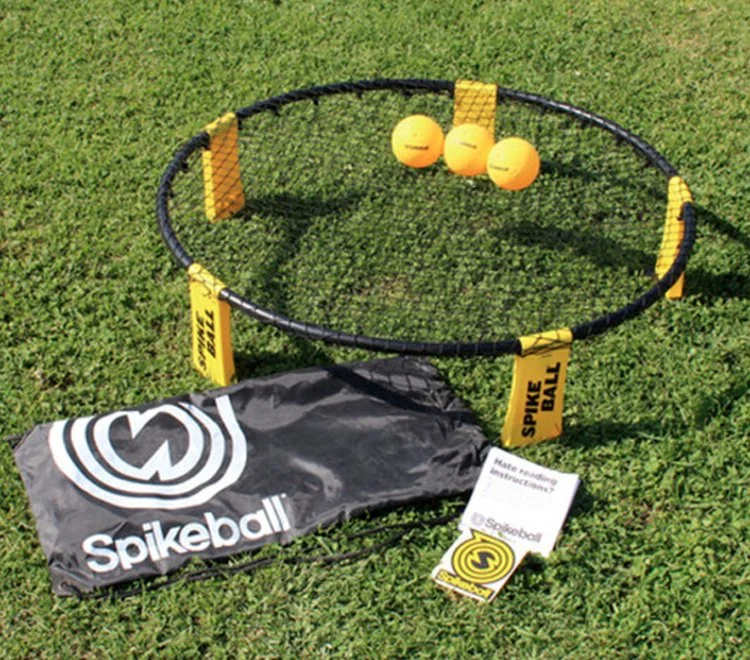 Spike ball / spyder ball game being played outdoors