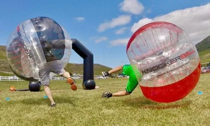 Players in Knockerballs acting as minnows running from a player as the shark in the middle