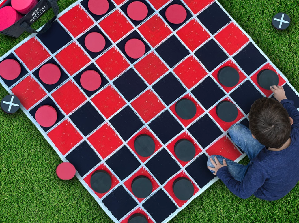 Combined checkers and tic tac toe lawn game