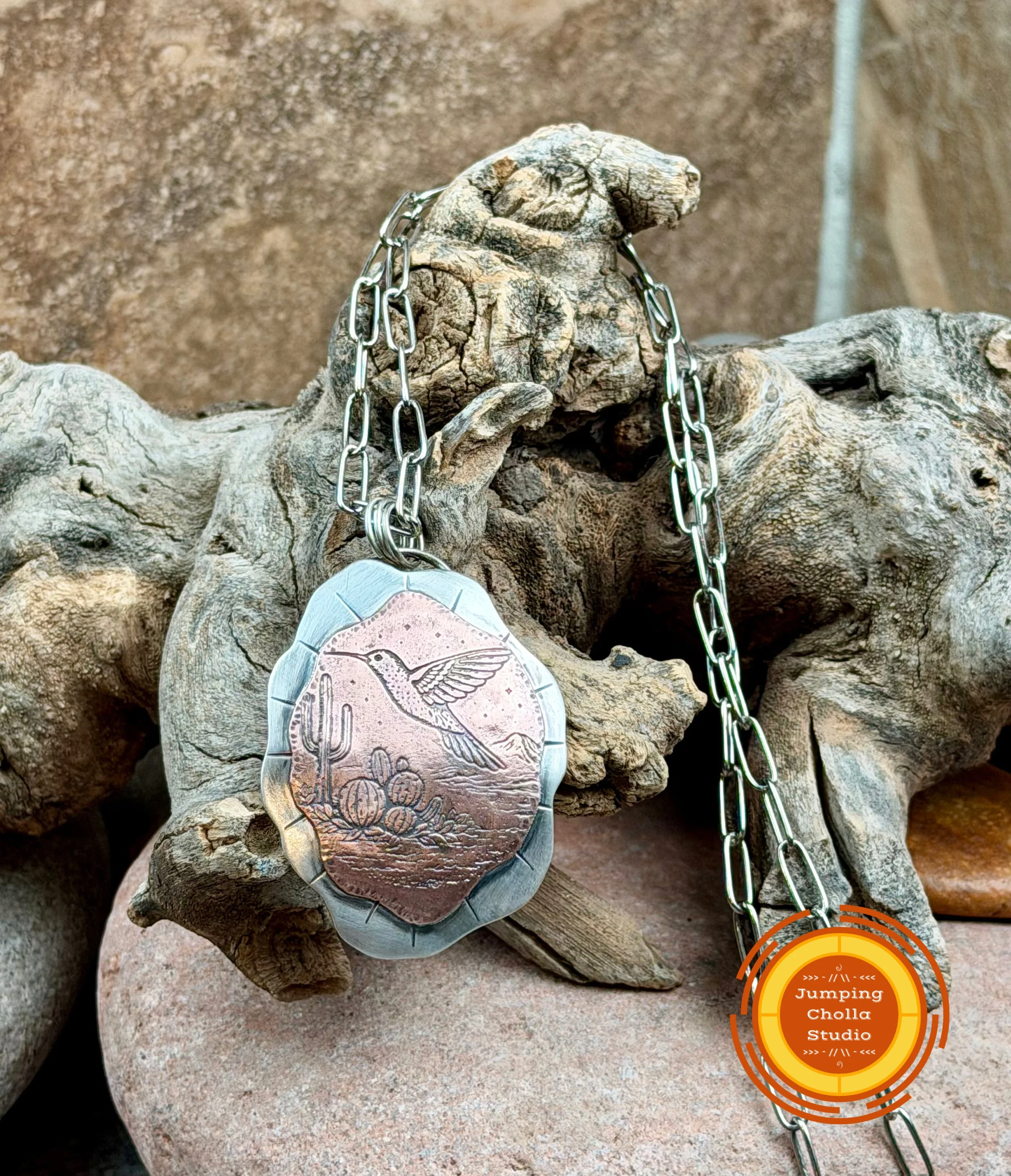 Handmade Morning Flight sterling silver and copper pendant inspired by birds in flight. Artisan jewelry handcrafted in Arizona by Jumping Cholla Studio