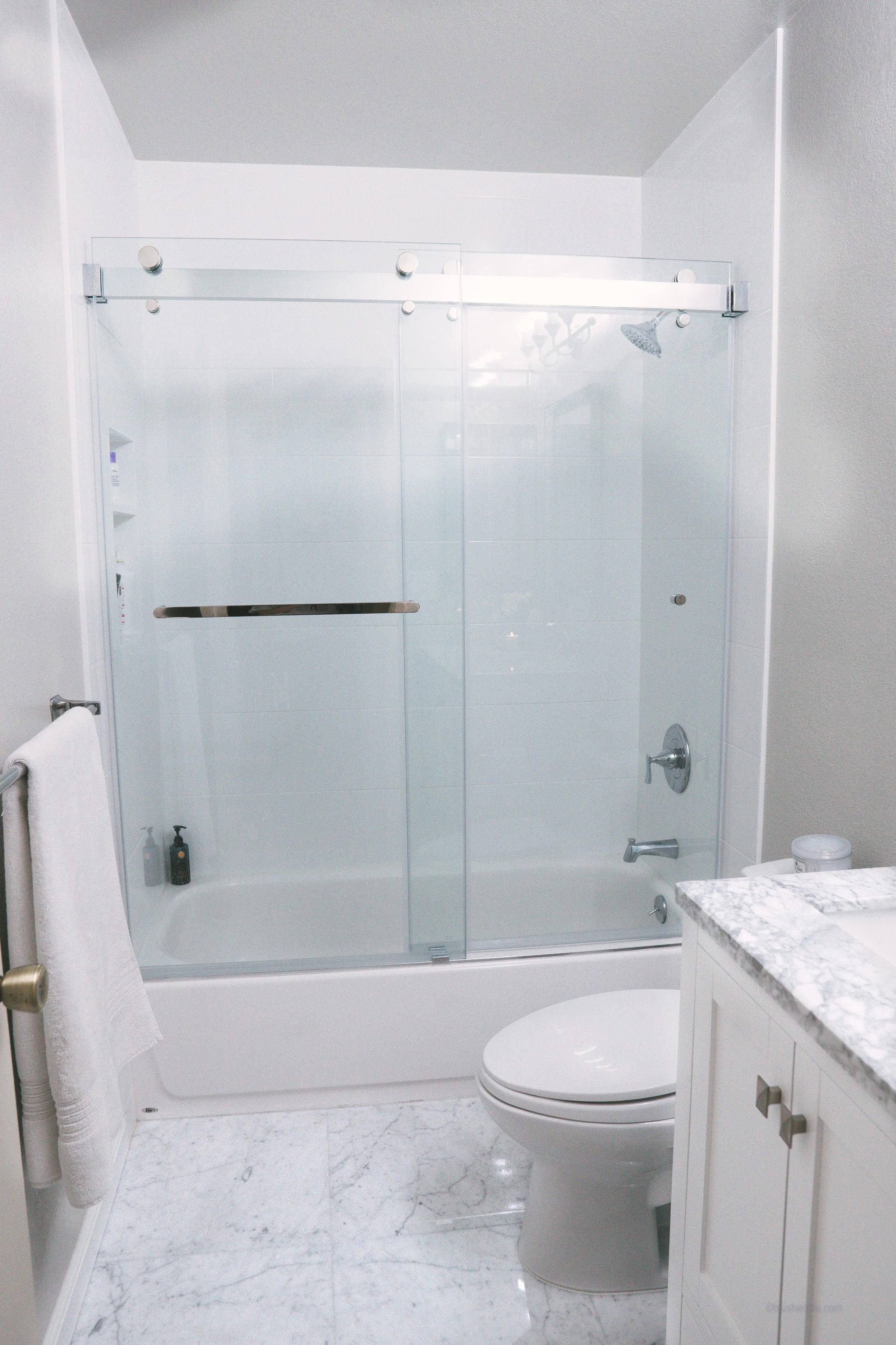 I had originally wanted to do 2-inch marble hexagon tiles on the floor to give contrast, but we had an issue with our vendor so we ended up with these large pieces of carrara marble.