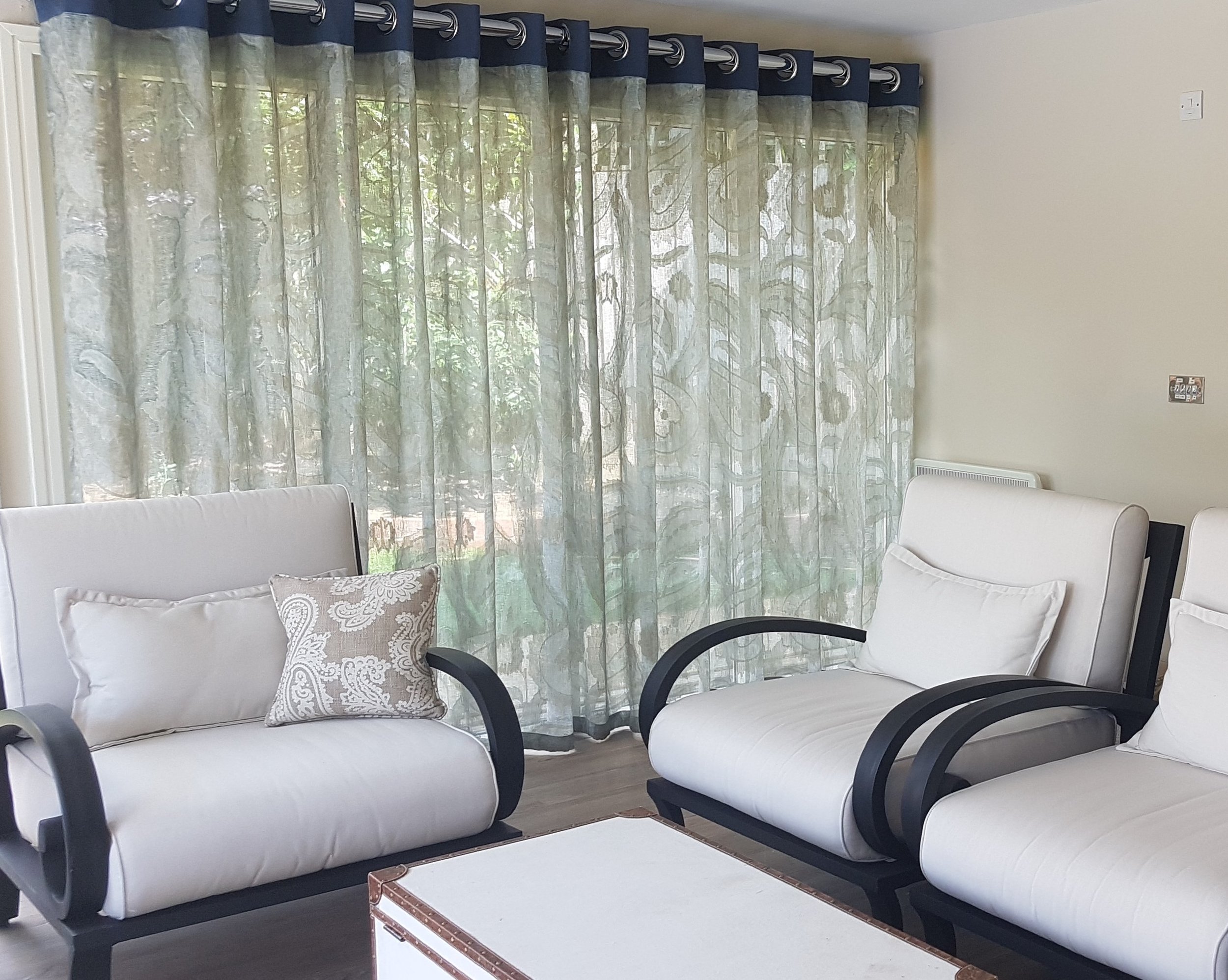 Eyelet headed curtains with contrasting fabrics