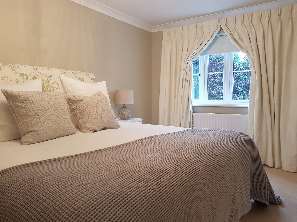 Italian strung curtains create a soft look in the bedroom