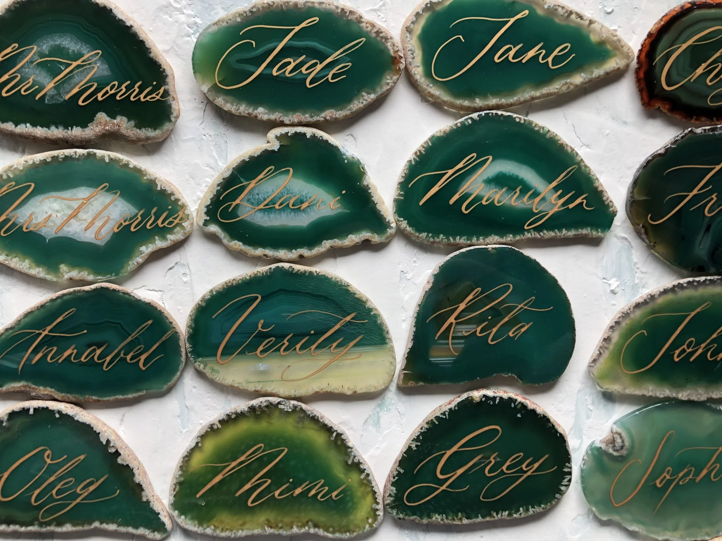 Green agate with gold ink calligraphy handwritten